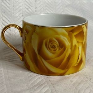 Yellow/gold espresso cup by Classic Coffee.